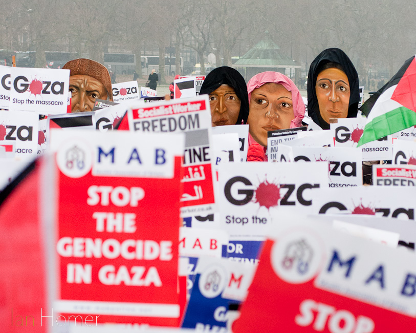 Hyde Park, London, 10th January 2009. Placards and masks. Protest against the Israeli bombing of Gaza.