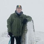 Ian Homer Photography. Ben Lomond - Ian Homer poses - it's all white at the summit trig point.