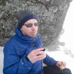 Ian Homer Photography. Ben Lomond:Time for lunch, sheltering from a strengthening bitter cold wind under a rock.